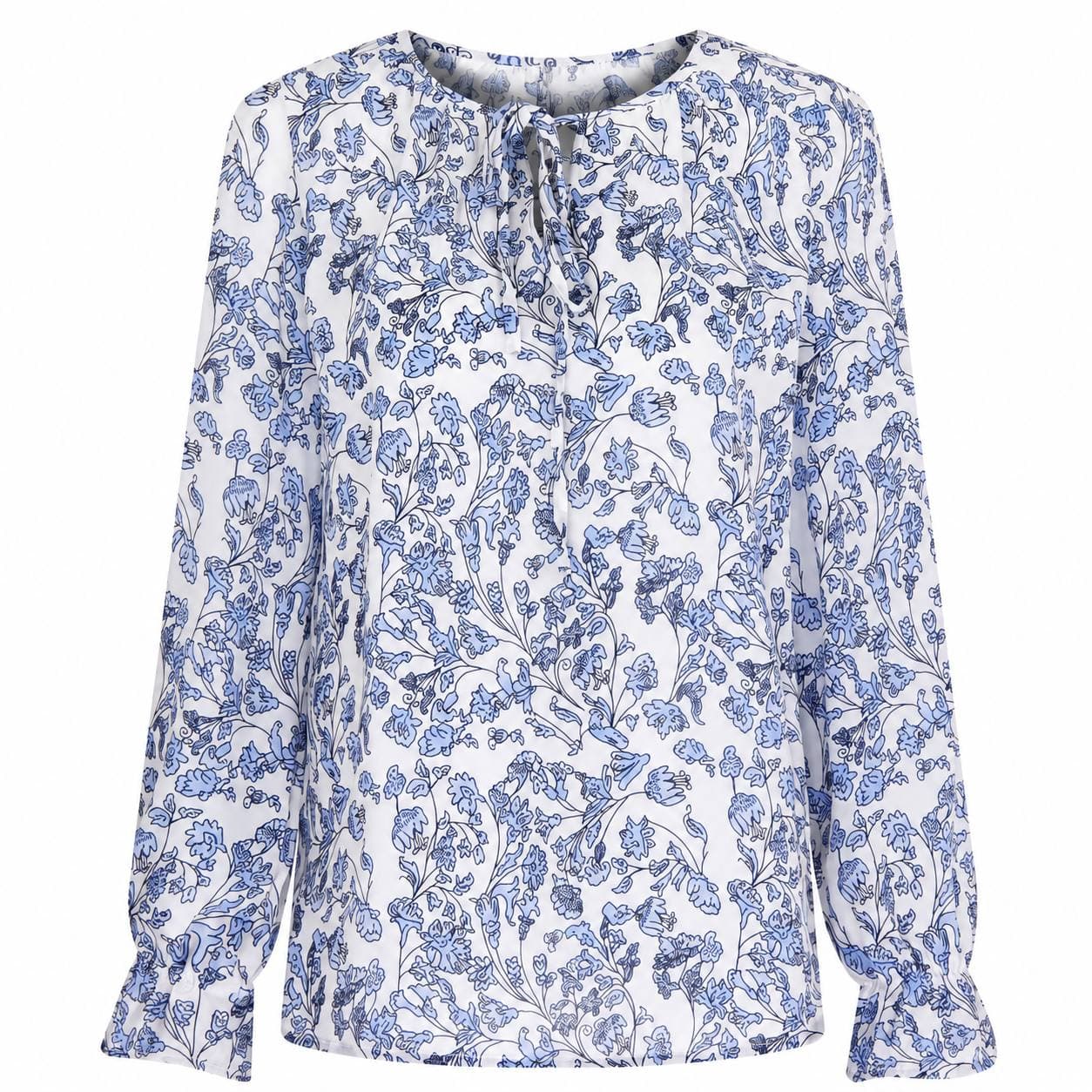 Model wearing Yvonne Collection floral peplum top — chic everyday blouse